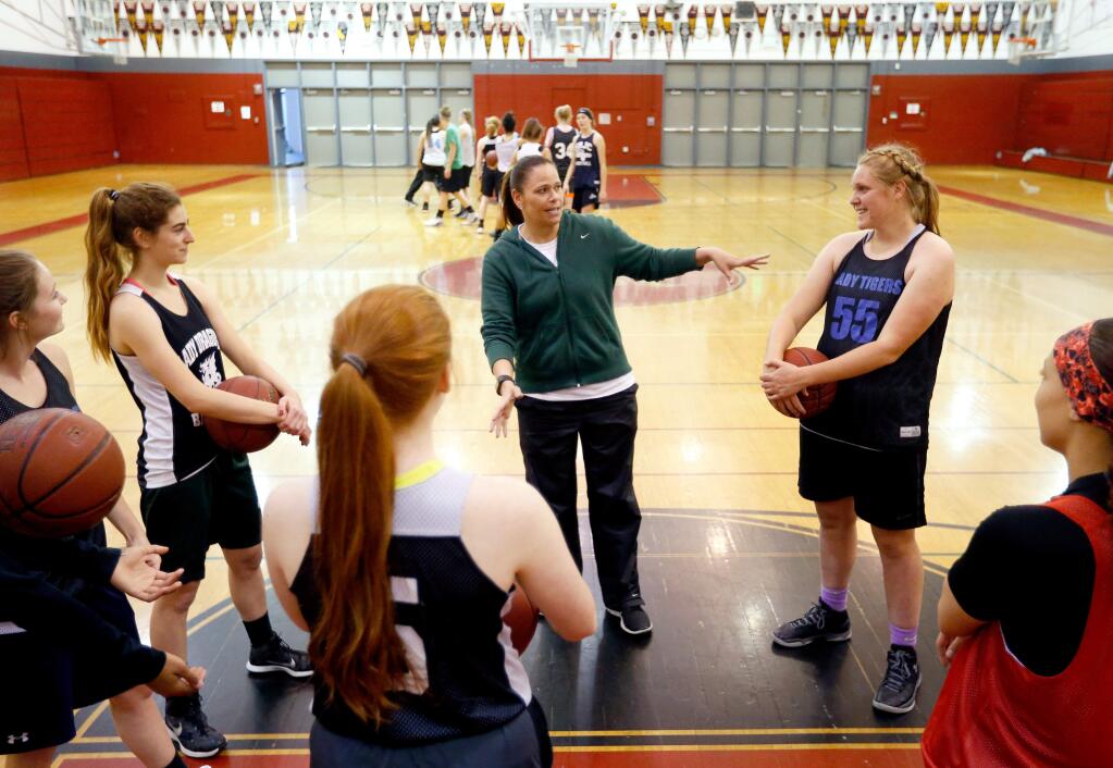 SCL all-star team coach Jann Thorpe, center, gestures toward Analy's Bella Niedermair as Thorpe introduces the players to each other during SCL all-star team practice in Santa Rosa on Thursday, April 13, 2017. Niedermair will play in both the SCL-NBL all-star basketball game and all-star soccer match. (Alvin Jornada / The Press Democrat)