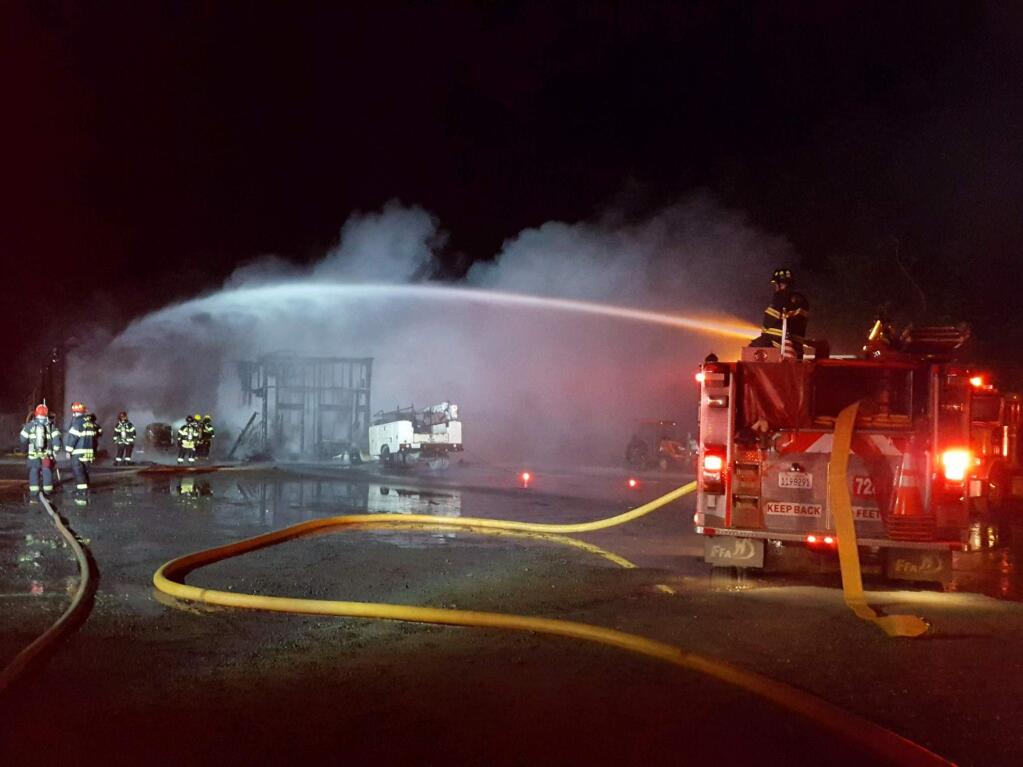 Firefighters battle a fire at a trucking company in Santa Rosa early Wednesday, May 24, 2017. (COURTESY OF RINCON VALLEY FIRE CHIEF JACK PICCININI)