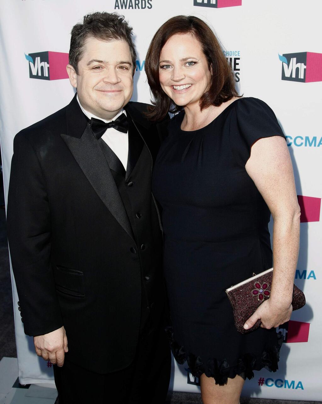 FILE - In this Jan. 12, 2012 file photo, Patton Oswalt, left, and his wife Michelle Eileen McNamara arrive at the 17th Annual Critics' Choice Movie Awards in Los Angeles. Oswalt has authored a touching essay for Time that was published on May 3, 2016, nearly two weeks after McNamara's unexpected death. (AP Photo/Matt Sayles, File)