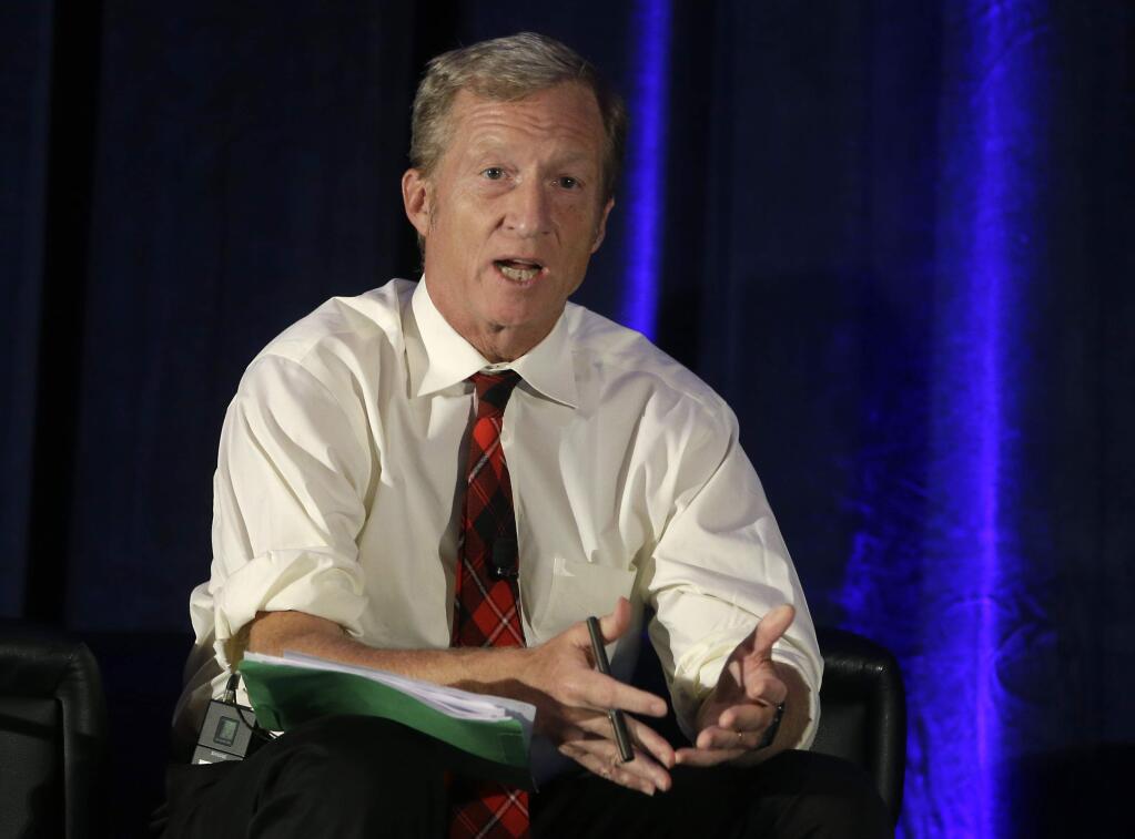 FILE - In this Oct. 7, 2015, file photo, billionaire environmentalist Tom Steyer discusses climate change at a symposium in Sacramento, Calif. Steyer is dumping at least $10 million into a national advertising campaign calling for President Donald Trump's impeachment. (AP Photo/Rich Pedroncelli, file)