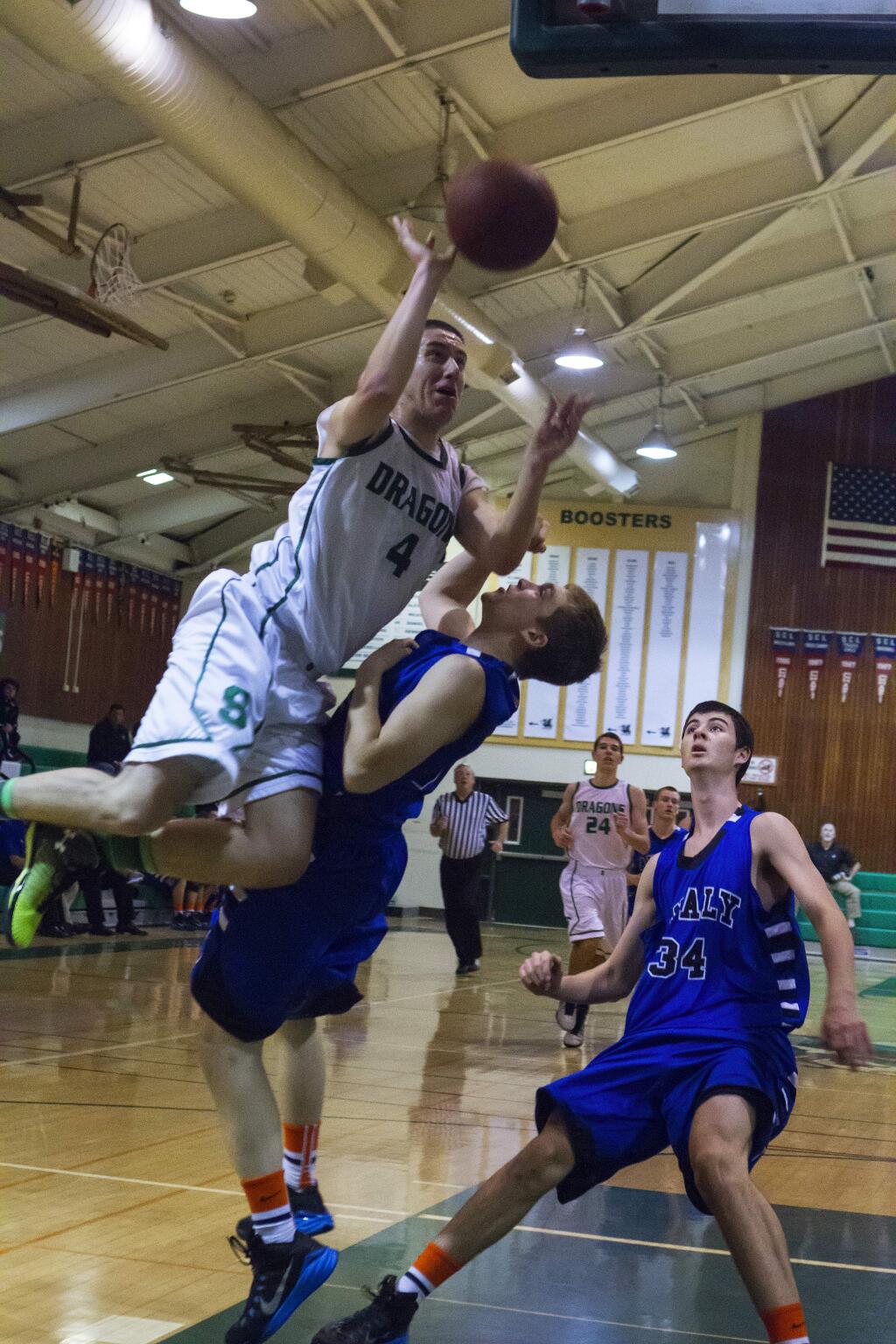 Sonoma's Ryan Fisher powers his way to the basket as teammate Ryan Wilbanks (back, No. 24) follows the play during the Dragons' SCL-opening loss to defending champion, Analy, on Wednesday night, 7 Jan, in Pfeiffer Gym. (Photos by Robbi Pengelly/Index-Tribune)