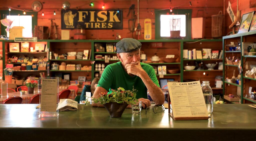 Charles Brown takes a break for lunch as his daughter, Jimtown Store owner Carrie Brown and her staff prep meals for the day, Thursday, July 18, 2019. (Kent Porter / The Press Democrat) 2019