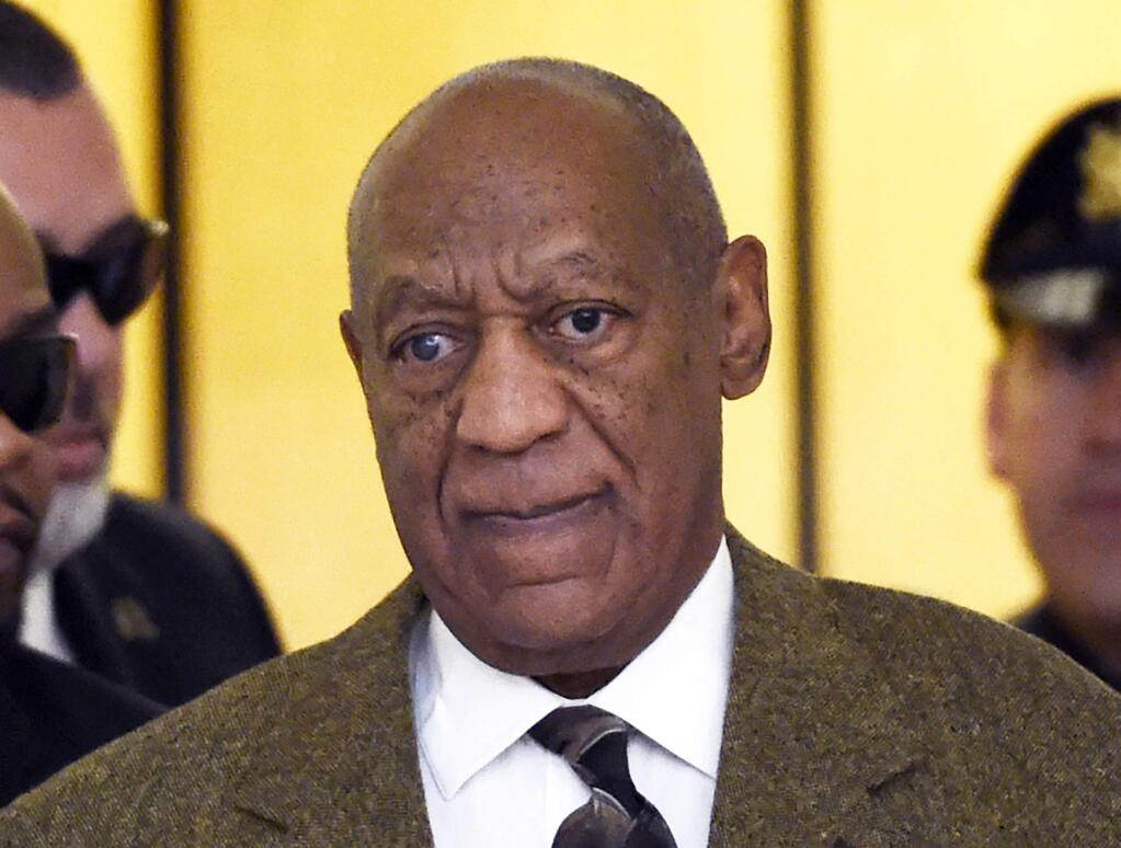 FILE - In this Feb. 2, 2016 file photo, actor and comedian Bill Cosby arrives for a court appearance in Norristown, Pa. A model who claims Bill Cosby sexually abused her at the Playboy Mansion in 2008 has filed a new lawsuit against the comedian and Playboys founder Hugh Hefner. Chloe Goins lawsuit claims Hefner knew or should have known that Cosby had drugged and sexually abused women and enabled his behavior. (Clem Murray/The Philadelphia Inquirer via AP, Pool, File)