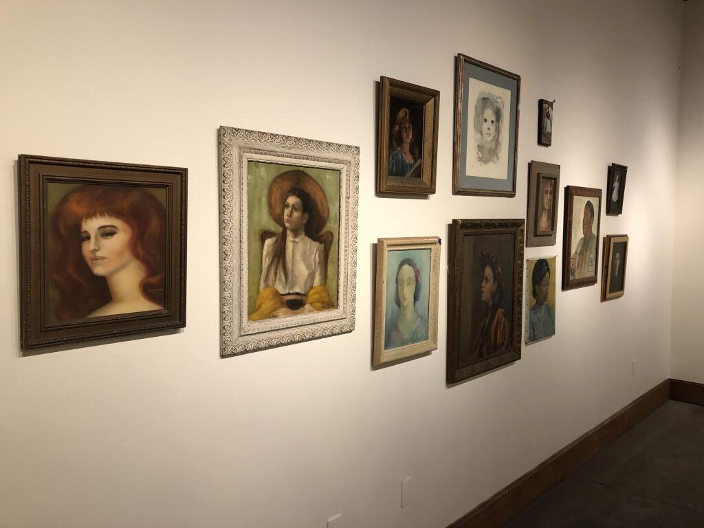 A wall of protraits collected over the years by Warren Davis, on display for two wooks at the Petaluma Arts Center,(PHOTO BY DAVID TEMPLETON)