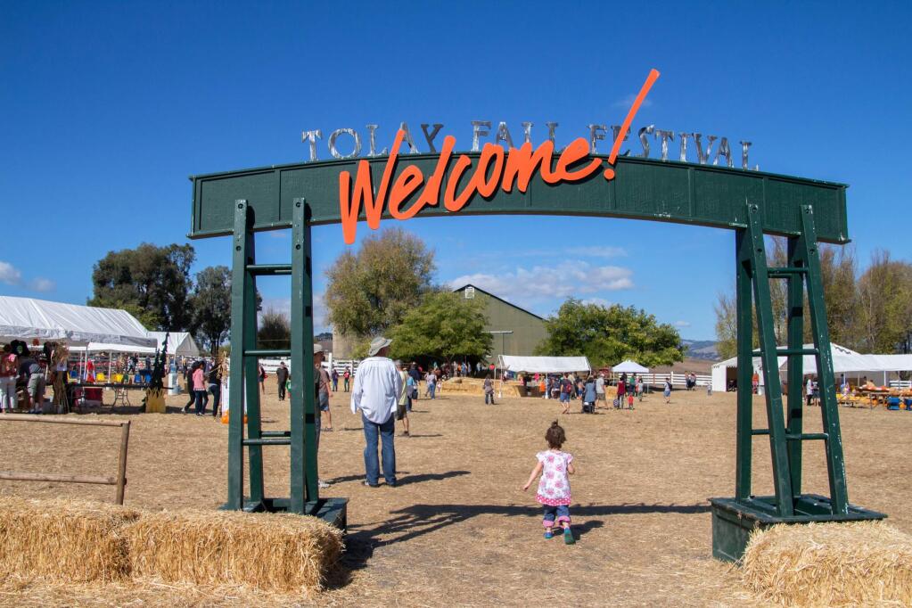 Patrons enter the Tolay Fall Festival to join in the festivities at Tolay Lake Regional Park on Sunday, October 18, 2015. (ASHLEY COLLINGWOOD/FOR THE ARGUS-COURIER)