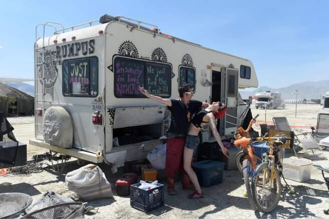 Eric Peltier and Martha Lackritz celebrate their honeymoon at Burning Man in 2014. (AP FILE)