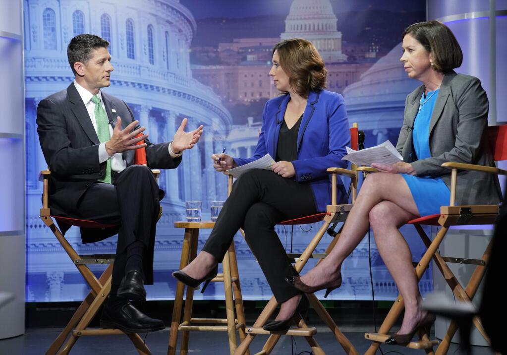 House Speaker Paul Ryan of Wis., left, answers questions during an interview with Julie Pace, AP chief of bureau in Washington and Erica Werner, AP congressional correspondent, at the Associated Press bureau in Washington, Wednesday, Sept. 13, 2017. (AP Photo/Pablo Martinez Monsivais)