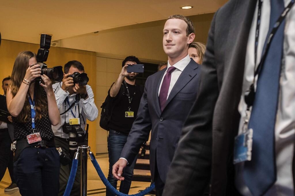Facebook CEO Mark Zuckerberg leaves the EU Parliament in Brussels on Tuesday, May 22, 2018. European Union lawmakers plan to press Zuckerberg on Tuesday about data protection standards at the internet giant at a hearing focused on a scandal over the alleged misuse of the personal information of millions of people. (AP Photo/Geert Vanden Wijngaert)