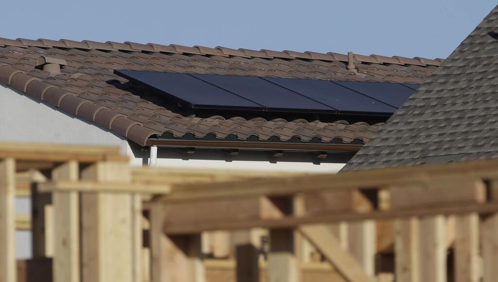 Solar panels are seen on the rooftop on a home in a new housing project in Sacramento, California. (AP Photo/Rich Pedroncelli, May 7, 2018)