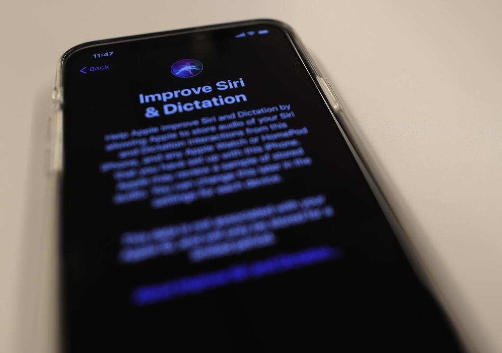 A screen displays a notice when installing the update, iOS 13.2 on an iPhone on Tuesday, Oct. 29, 2019, in New York. Apple is resuming the use of humans to review Siri commands and dictation with the latest iPhone software update. Individuals can choose “Not Now” to decline audio storage and review. (AP Photo/Jenny Kane)