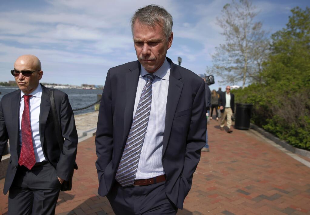 FILE - In this May 22, 2019 file photo, Peter Jan Sartorio leaves federal court in Boston after pleading guilty to charges in a nationwide college admissions bribery scandal. Sartorio was sentenced on Friday, Oct. 11, to one year of probation. (AP Photo/Michael Dwyer, File)
