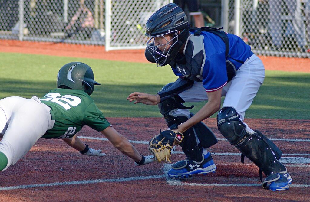 SUMNER FOWLER/FOR THE ARGUS-COURIERSt. Vincent catcher Nathan Bemiklaui has the ball ready for Sonoma Academy base runner Chance Colbert. Berniklau returns to give the Mujstangs a solid receiver.