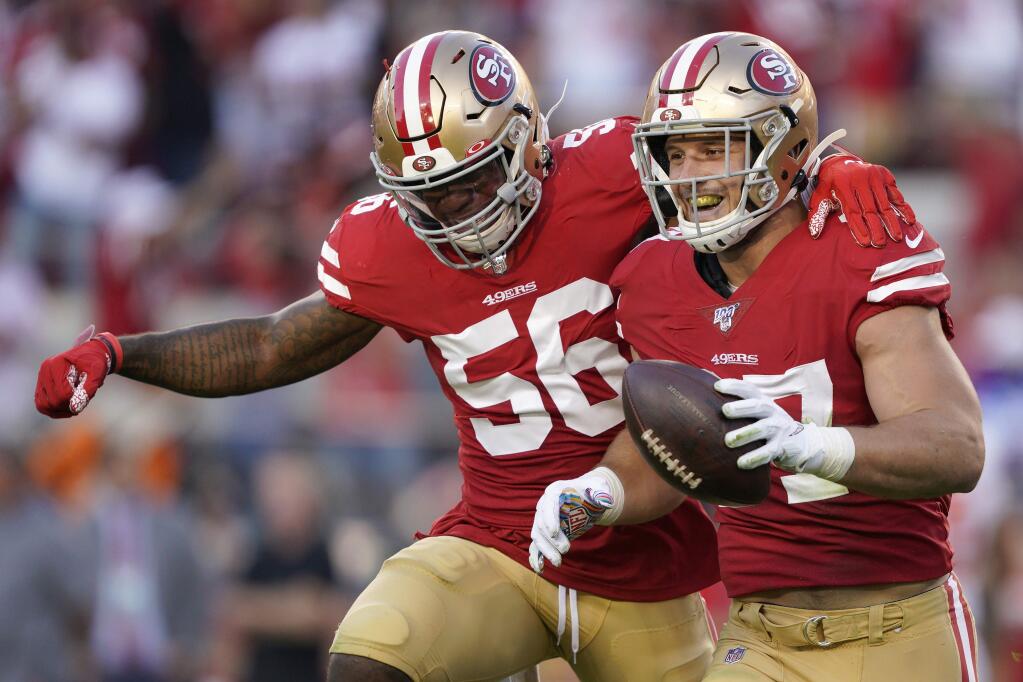 San Francisco 49ers defensive end Nick Bosa, right, celebrates with middle linebacker Kwon Alexander after recovering a fumble by Cleveland Browns quarterback Baker Mayfield during the first half in Santa Clara, Monday, Oct. 7, 2019. (AP Photo/Tony Avelar)