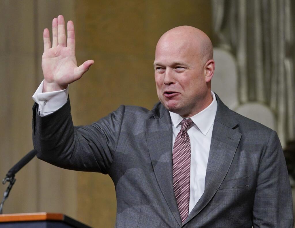 Acting Attorney General Matthew Whitaker gestures after speaking at the Dept. of Justice's Annual Veterans Appreciation Day Ceremony, Thursday, Nov. 15, 2018, at the Justice Department in Washington. (AP Photo/Pablo Martinez Monsivais)
