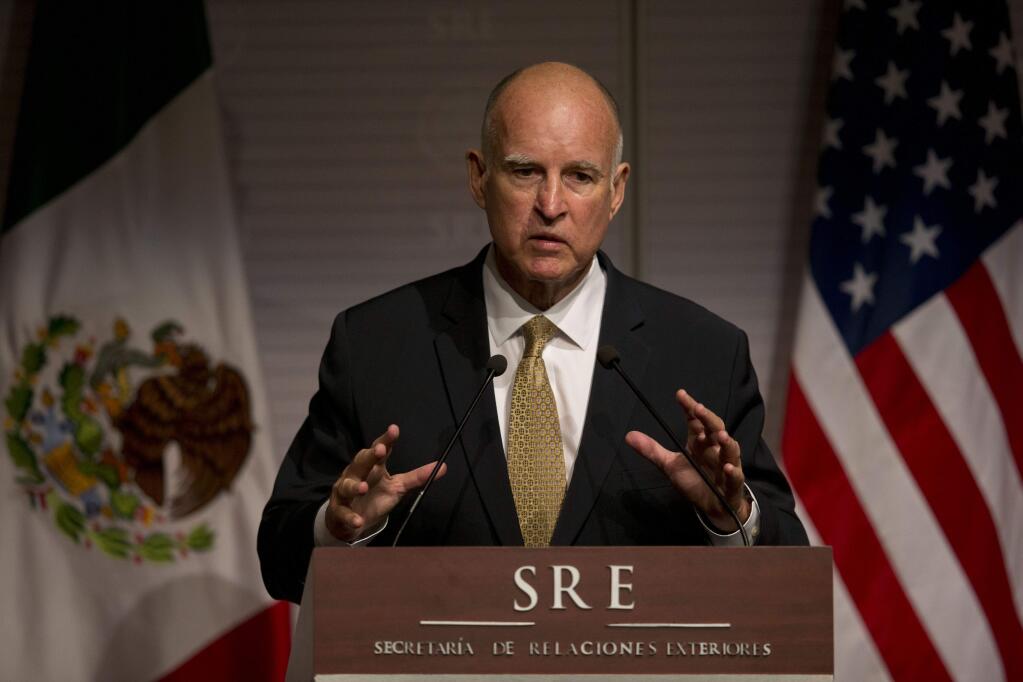 California Governor Jerry Brown answers questions from the press during a joint press conference with Mexico's Secretary of Foreign Affairs Jose Antonio Meade in Mexico City, Monday, July 28, 2014. (AP Photo/Rebecca Blackwell)