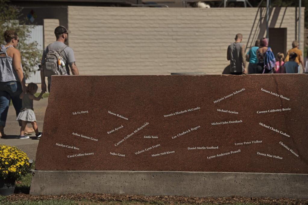 The names of the 24 Sonoma County residents who died during the 2017 wildfires etched in stone during a dedication honoring their lives and held Sunday at Luther Burbank Center for the Arts in Santa Rosa, California. October 6, 2019.(Photo: Erik Castro/for The Press Democrat)