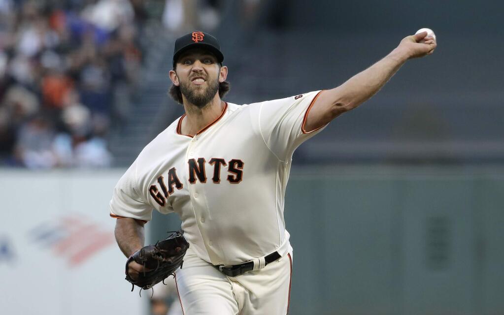 San Francisco Giants pitcher Madison Bumgarner throws to a Chicago Cubs batter during the fourth inning in San Francisco, Tuesday, July 23, 2019. (AP Photo/Jeff Chiu)