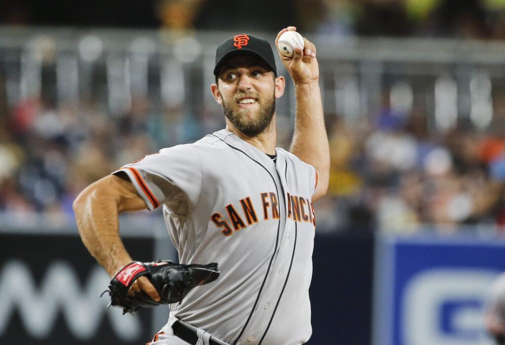 San Francisco Giants starting pitcher Madison Bumgarner works against the San Diego Padres during the first inning Friday, July 15, 2016, in San Diego. (AP Photo/Lenny Ignelzi)