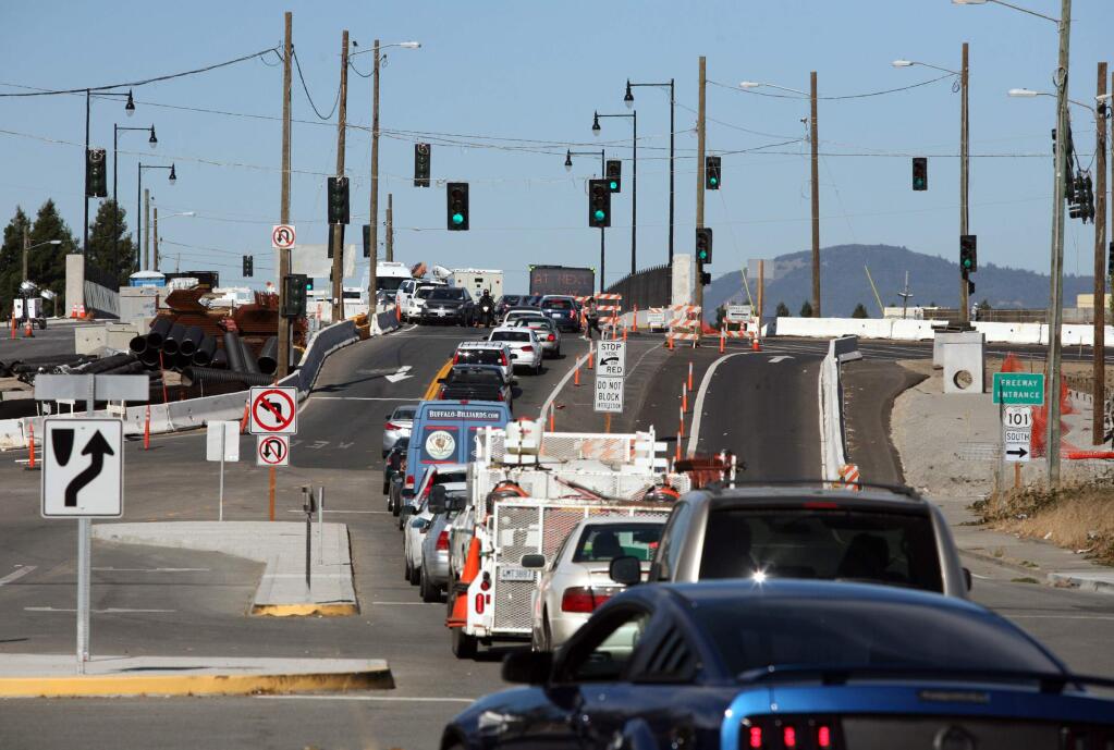 Even though the light is green the traffic has nowhere to go as cars are backed up over the HWY 101 overpass at Old Redwood HWY on Tuesday afternoon, October 7, 2014. (SCOTT MANCHESTER/ARGUS-COURIER STAFF)