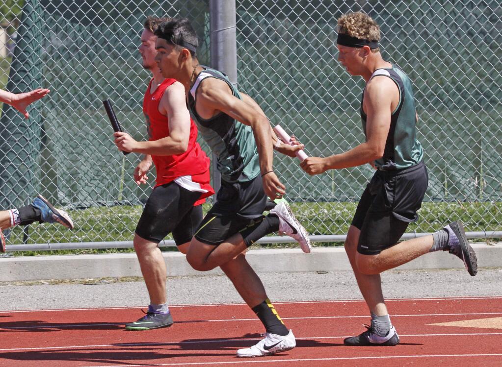 Bill Hoban/Index-TribuneKahlil Villas Martins, right, hands off to Jesus Robles in the 4x100 relay race Saturday at the North Coast Section track meet. In addition to running both the 4x100 and 4x400 races, Villas Martins ran in the 100 meters and finished sixth in that event which qualified him for the Meet of Champions in Berkeley this coming weekend.