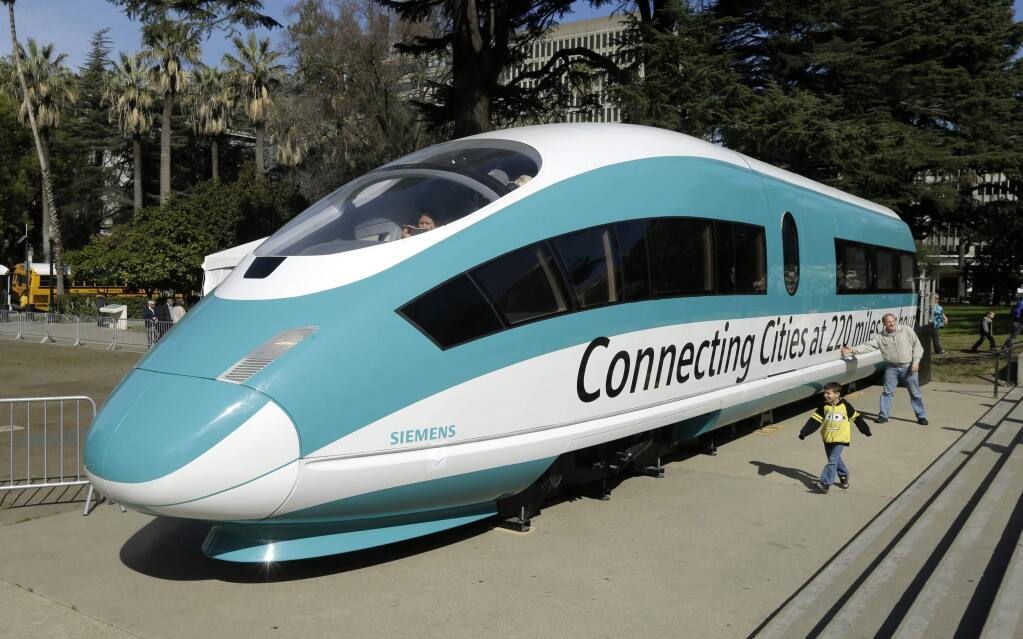 FILE - In Feb. 26, 2015, file photo, a a full-scale mock-up of a high-speed train is displayed at the Capitol in Sacramento, Calif. The state Senate Transportation Committee will hold a hearing, Tuesday, March 26, 2019, on the $77 billion project to build a high-speed rail line between Los Angeles and San Francisco. (AP Photo/Rich Pedroncelli, File)