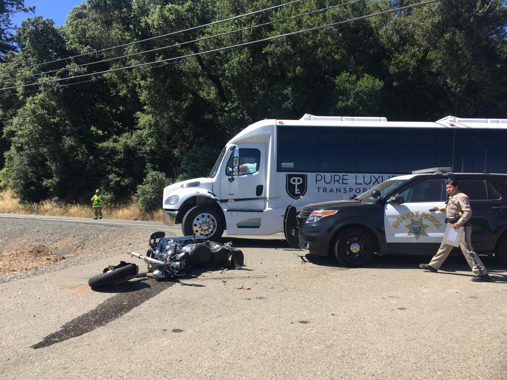 California Highway Patrol Officer Elsy Gonzalez monitors a crash near Geyersville on Saturday, June 22. Two were reported injured in a motorcycle versus bus crash. Photo: Will Schmitt.
