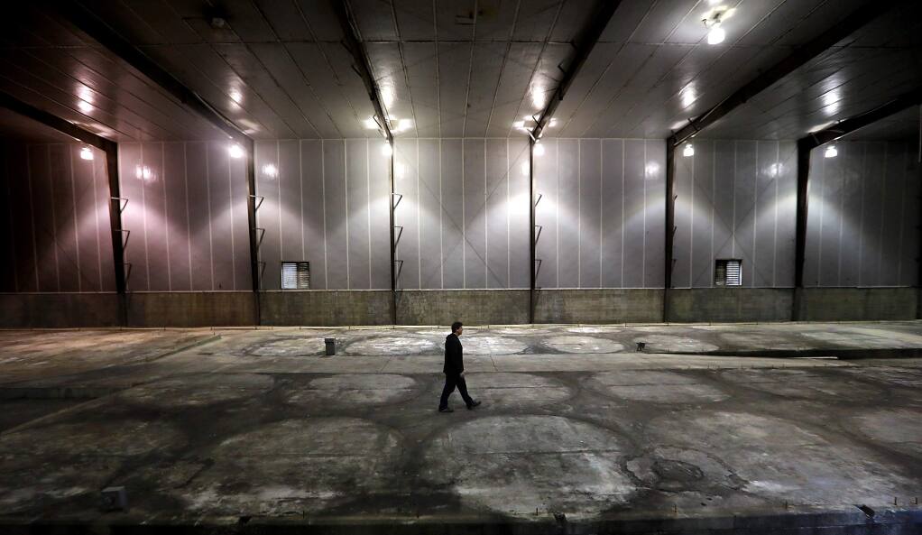 Flow Cana property director Sean Quinn stands in a former Fetzer Winery tank room the Flow Cannabis Institute plans to convert into a three story marijuana drying and processing facility. (John Burgess/The Press Democrat)