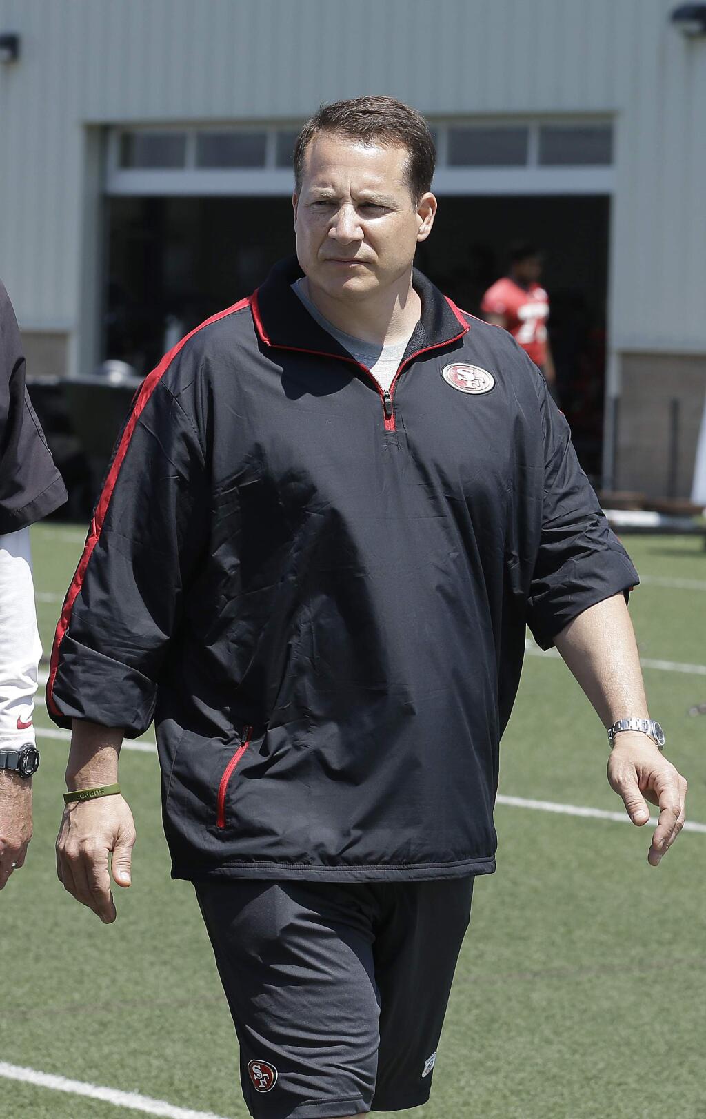 San Francisco 49ers offensive consultant Eric Mangini walks off the field after practice at an NFL football training camp in Santa Clara, Tuesday, June 4, 2013. (AP Photo/Jeff Chiu)