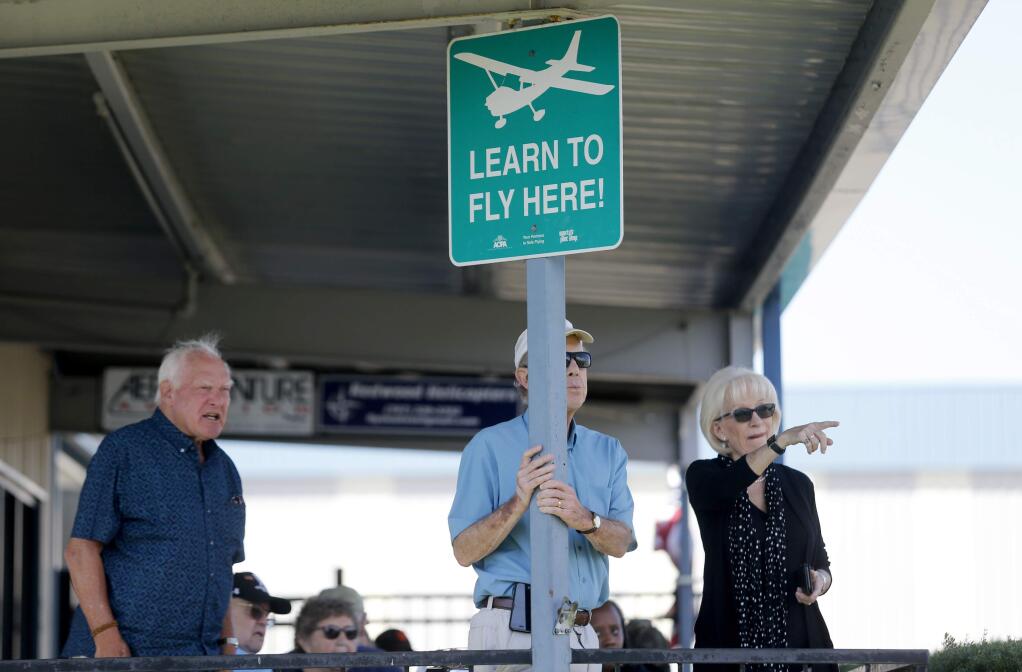 (From right)Pamela Blinn, her husband Bruce and her brother Norman Harvey look out across the runway of the Petaluma Municipal Airport after eating lunch at the Two Niner Diner on Wednesday, September 21, 2016 in Petaluma, California . (BETH SCHLANKER/ The Press Democrat)