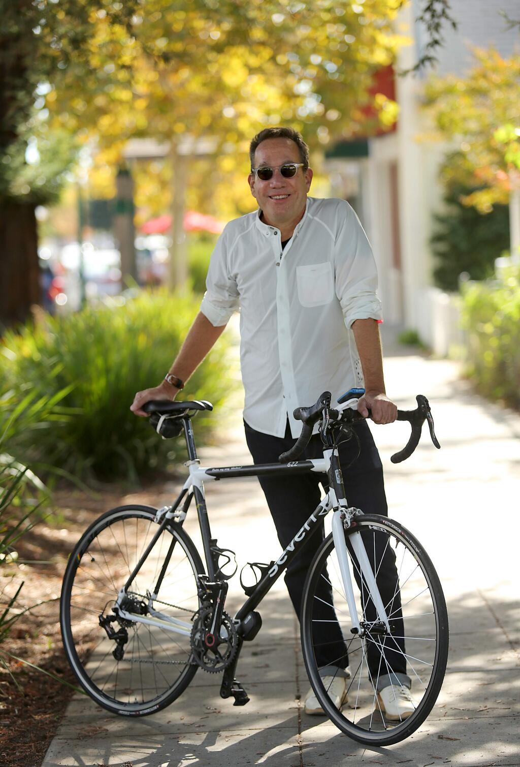 Roy Parvin, an author and avid cyclist, is helping raise money to get unique art pieces installed in downtown Cloverdale that are also bicycle racks. (Crista Jeremiason / The Press Democrat)