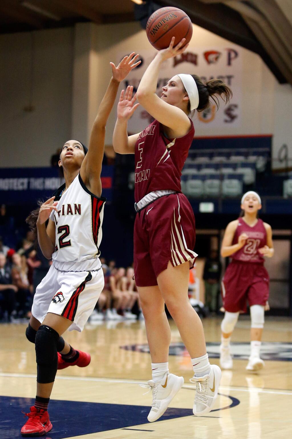Cardinal Newman's Maiya Flores (3), right, shoots over Salesian's Anjel Galbraith (22) during the first half of the NCS Division 3 girls varsity basketball championship game between Cardinal Newman and Salesian College Prep high schools,at St. Mary's College in Moraga, California, on Saturday, March 3, 2018. (Alvin Jornada / The Press Democrat)