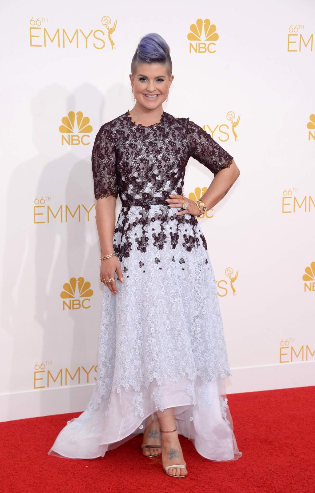 Kelly Osbourne arrives at the 66th Primetime Emmy Awards at the Nokia Theatre L.A. Live on Monday, Aug. 25, 2014, in Los Angeles. (Photo by Evan Agostini/Invision for the Television Academy/AP Images)