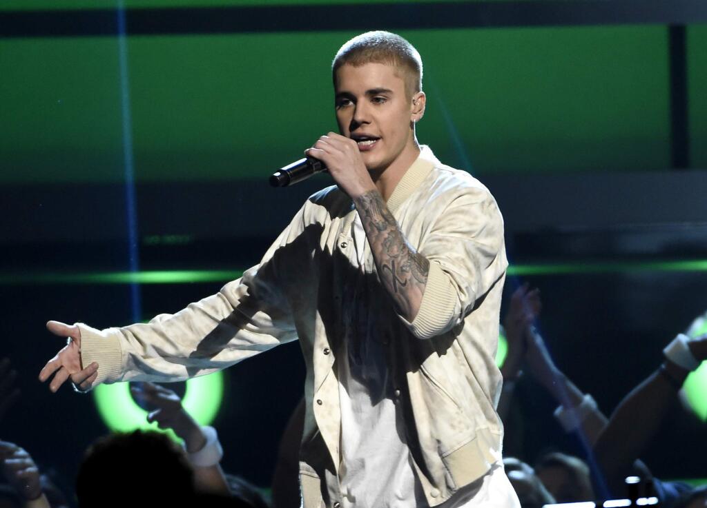 FILE - In this May 22, 2016 file photo, Justin Bieber performs at the Billboard Music Awards in Las Vegas. (Photo by Chris Pizzello/Invision/AP, File)