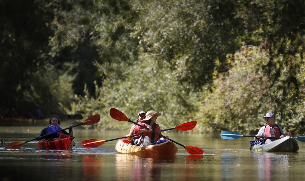 Members of a float trip organized Supervisor James Gore and LandPaths float down the Russian River near Vichy Springs Road as part of the start of a year-long effort to plot the future of the Russian River in Ukiah, on Wednesday, August 24, 2016. (BETH SCHLANKER/ The Press Democrat)