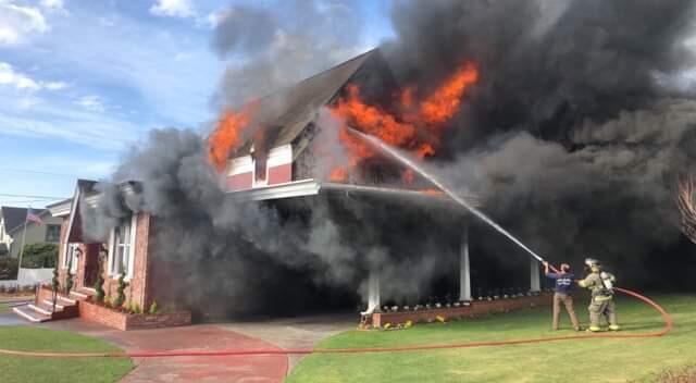 Firefighters battle a blaze at Chapel by the Sea in Fort Bragg on Saturday, Jan. 12, 2019. (BRITTANEY ALBONICO DONDANVILLE)