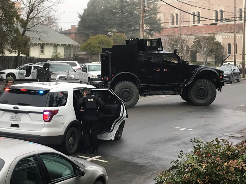 Petaluma police and SWAT converge on 11 Howard Street near St. Vincent's Church on Wednesday, Jan. 22, 2020, to issue warrants and apprehend three men suspected of pistol-whipping and robbing a local man twice earlier this month. (PETALUMA POLICE DEPARTMENT)