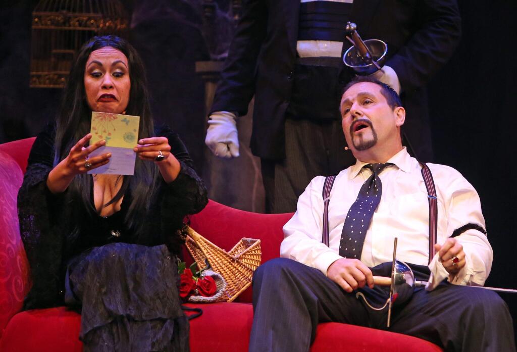 CREEPY & KOOKY - Morticia (Serena Elize Flores) and Gomez (Peter Downey) react to some bad news in 'The Addams Family Musical,' at Spreckels Performing Arts Center.