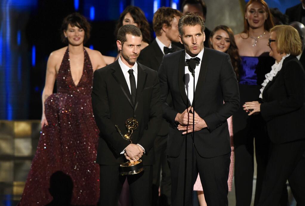 D. B. Weiss, left, and David Benioff accept the award for outstanding drama series for 'Game Of Thrones' at the 67th Primetime Emmy Awards on Sunday, Sept. 20, 2015, at the Microsoft Theater in Los Angeles. (Photo by Chris Pizzello/Invision/AP)
