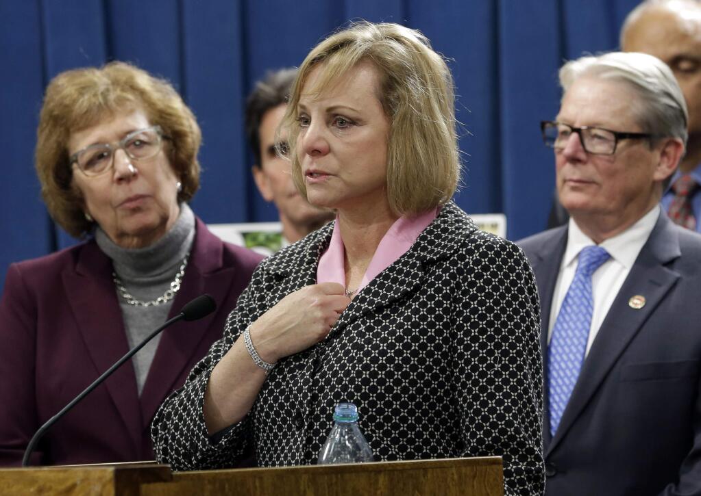 FILE - In this Wednesday, Jan. 21, 2015, file photo, Debbie Ziegler, center, the mother of Brittany Maynard, speaks in support of proposed legislation allowing doctors to prescribe life-ending medication to terminally ill patients during a news conference at the Capitol, in Sacramento, Calif. A bill, authored by Sen. Lois Wolk, D-Davis, left, and Sen. Bill Monning, D-Carmel, right, that would allow California physicians to help terminally ill patients end their lives, is struggling to muster enough support ahead of a legislative vote Tuesday, July 7, 2015. Maynard, a 29-year-old San Francisco Bay Area woman who had terminal brain cancer, moved to Oregon where she could legally end her life. (AP Photo/Rich Pedroncelli, File)