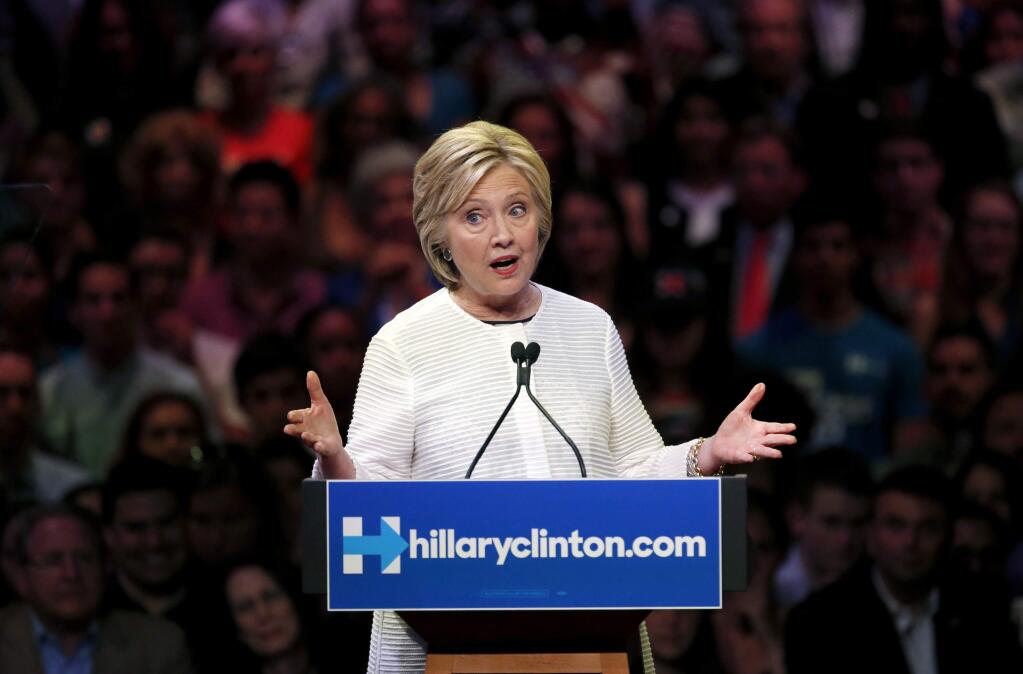 Democratic presidential candidate Hillary Clinton speaks during a presidential primary election night rally, Tuesday, June 7, 2016, in New York. (AP Photo/Julio Cortez)