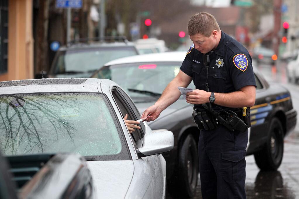 Santa Rosa Police Officer Jason Brandt issues a citation in 2010. (CHRISTOPHER CHUNG/ PF FILE)