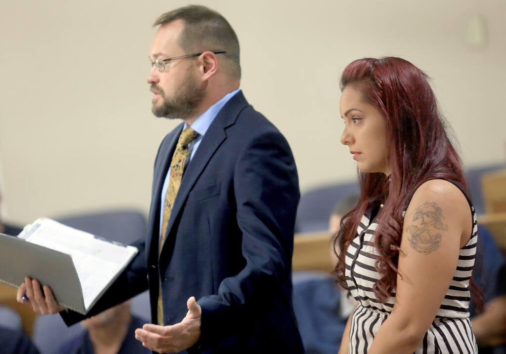 Ben Adams, left, the attorney for Delia Garcia-Bratcher, right, who is accused of grabbing the throat of a 12-year-old boy while confronting him on an elementary school campus about bullying her daughter, reacts to the District Attorney's request to postpone filing charges, Thursday July 17, 2014 in Sonoma County Superior Court in Santa Rosa. (Kent Porter / Press Democrat) 2014