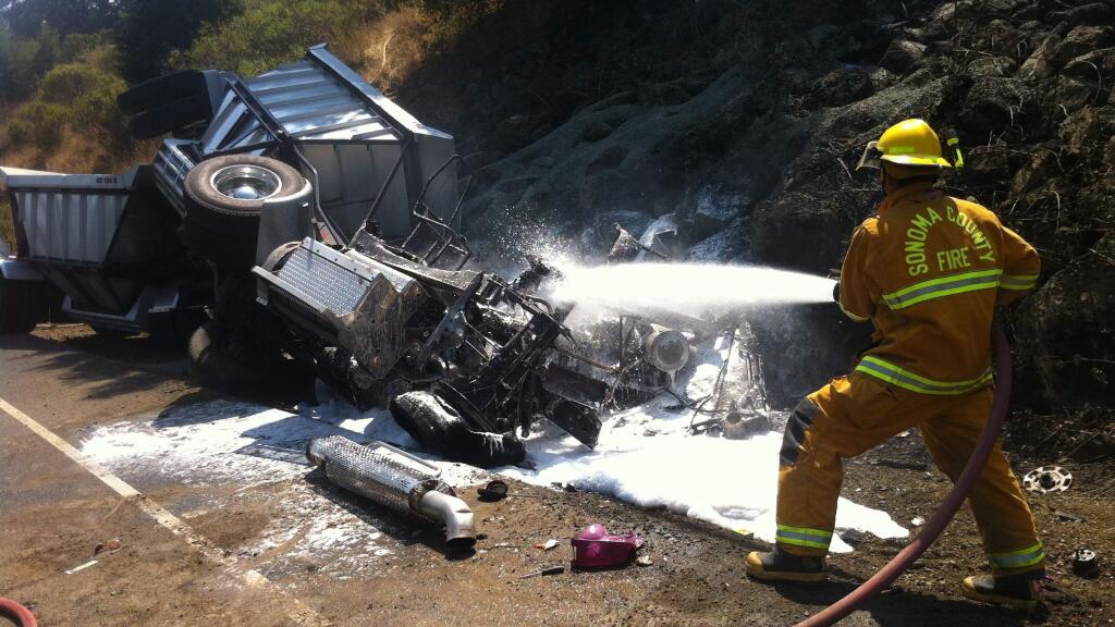 Emergency crews at the scene of a big rig crash on Porter Creek Road on Monday, Aug. 17, 2015. (KENT PORTER/ PD)