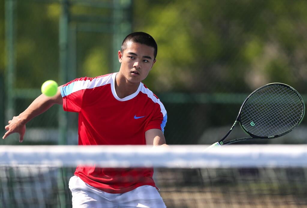 Rancho Cotate tennis standout Josh Wong hits a forehand volley during practice in Rohnert Park on Monday, April 30, 2018. (Christopher Chung / The Press Democrat)