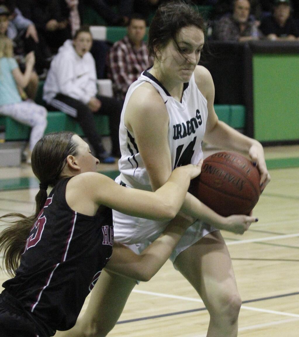 Bill Hoban/Index-TribuneSonoma's Sydney Von Gober (#14) fights to keep a rebound during Friday night's game against Healdsburg. The Dragons and Greyhounds went to overtime with Sonoma coming out with a 54-52 win.