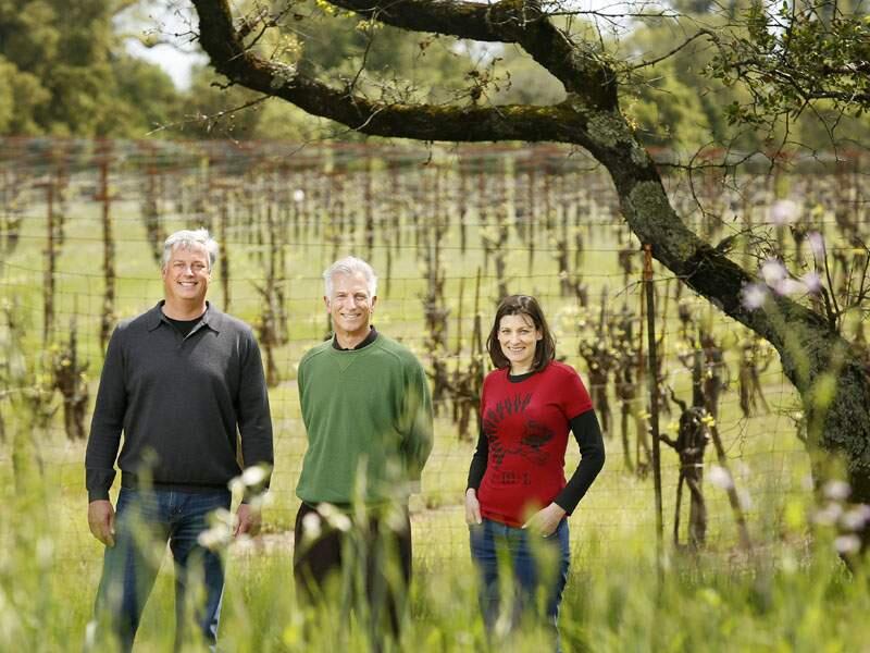 (File photo) Truett-Hurst CEO and co-founder Phil Hurst, chief financial officer Jim Bielenberg and partner and winemaker Virgina Lambrix stand by the vineyards at VML Winery in Healdsburg at on Wednesday, April 3, 2013. (Conner Jay/The Press Democrat)