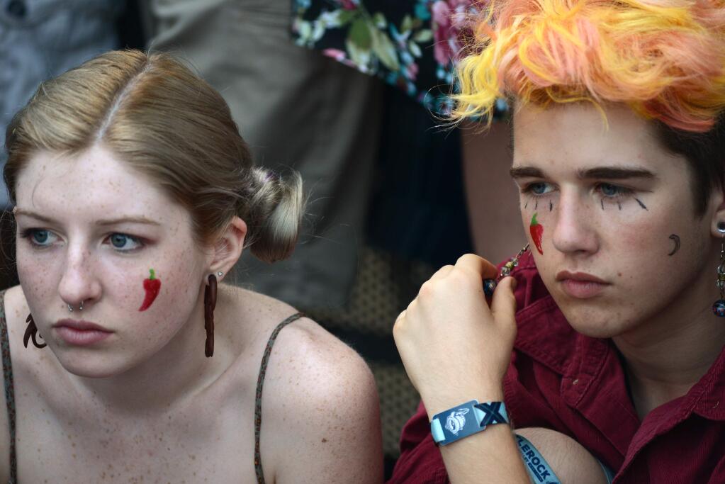 Brenna Boss, 16, left and her brother Braden Boss, 15 both from Napa staking out the front row of the JaM Cellars Stage while waiting for the Red Hot Chili Peppers to perform later tonight during BottleRock music festival in Napa, California, Sunday, May 29, 2016.(Photo: Erik Castro/for The Press Democrat)