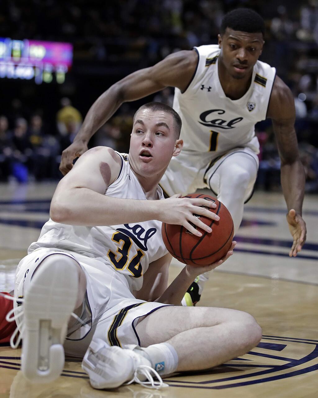 Cal's Grant Anticevich (34) looks to pass from the floor during the first half against USC on Saturday, Feb. 16, 2019, in Berkeley. (AP Photo/Ben Margot)