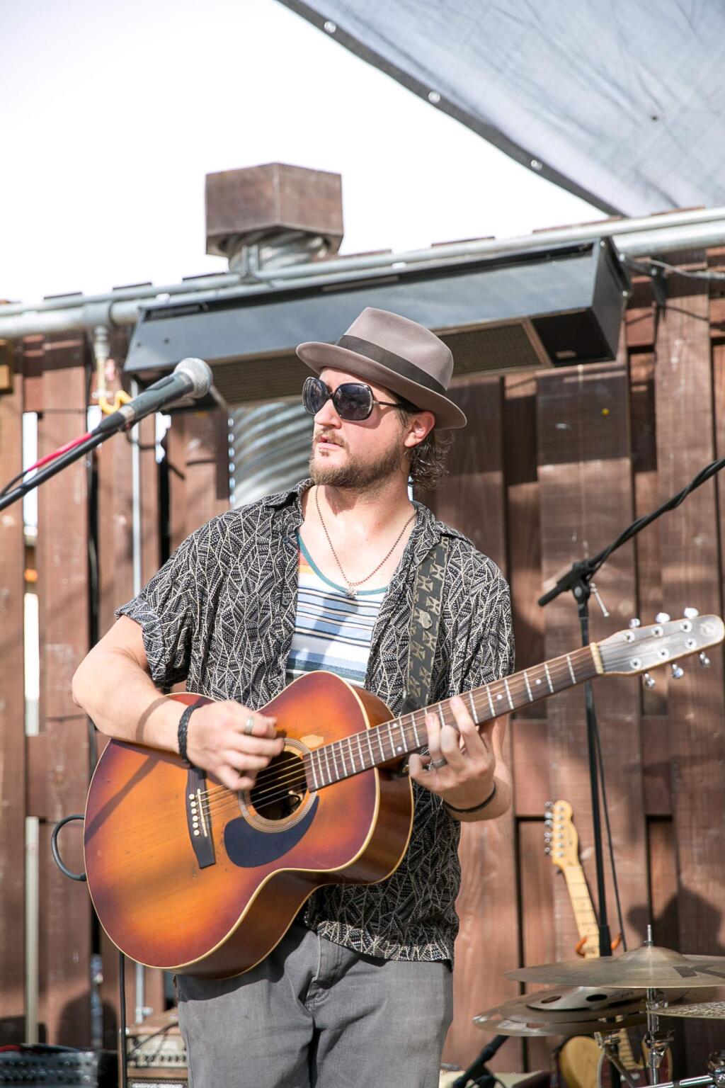 Sebastian Nau performs with the Highway Poets at the 4th Annual Brews and Bites for Bounty on Tuesday, July 28, 2015. (RACHEL SIMPSON/FOR THE ARGUS-COURIER)