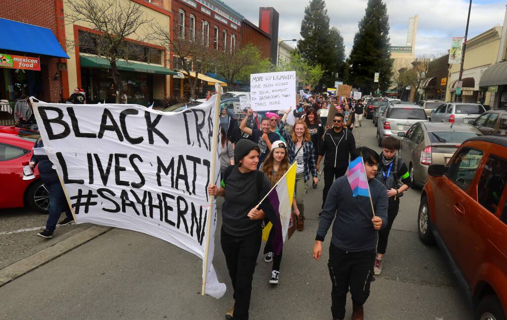 About 250 people marched through downtown Santa Rosa on Saturday afternoon in support of transgender rights. (John Burgess/The Press Democrat)